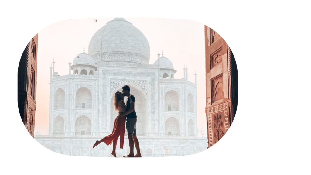 A couple kissing in front of the Taj Mahal in Agra, India