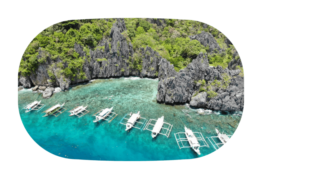 drone shot of local boats in the bay of El Nido, Philippines