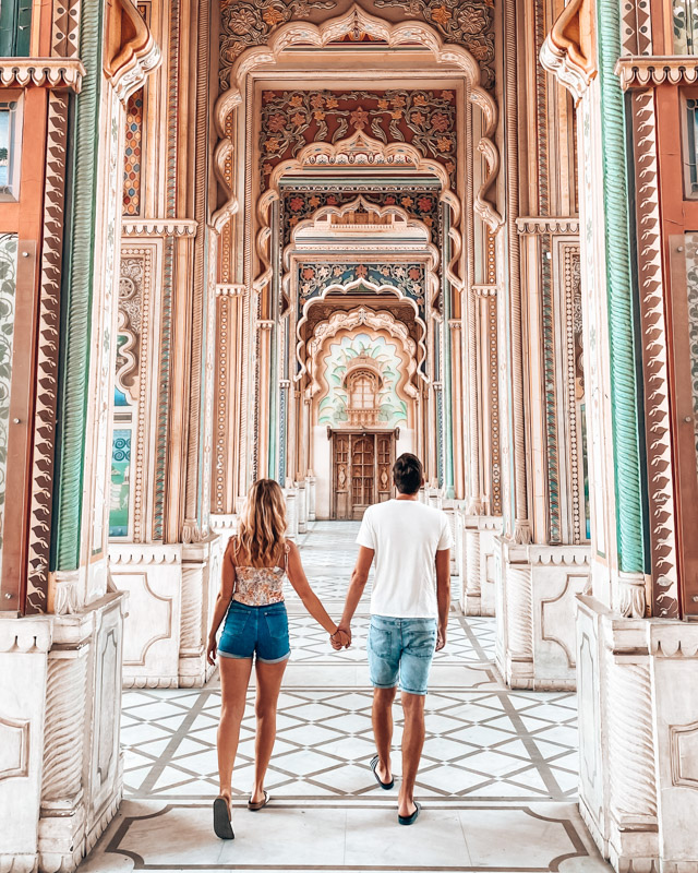 A couple walks through Patrika Gate in Jaipur, India