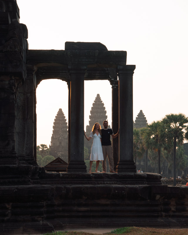 Couple stands in front of Angkor Wat, Cambodia